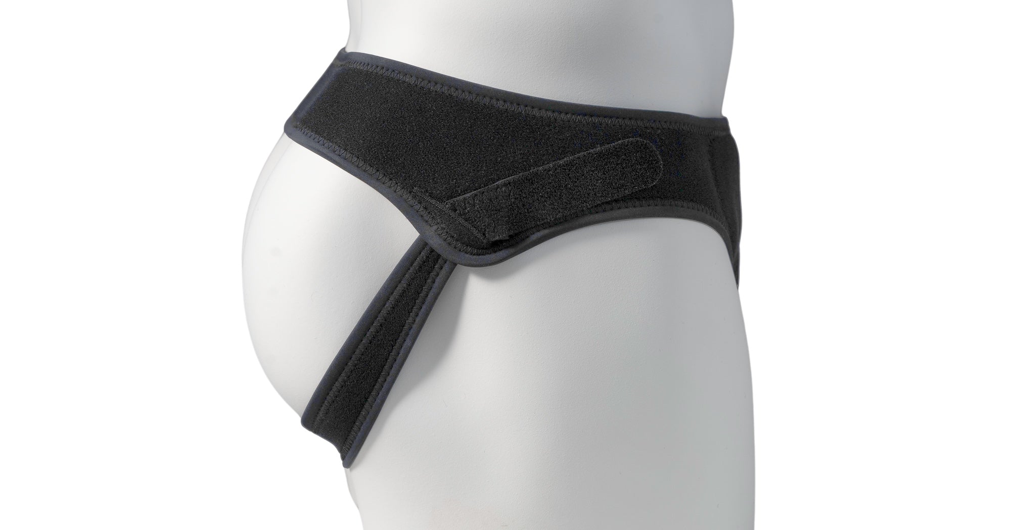Low profile hernia belt shown on a mannequin from the side to highlight its thin, discreet, everyday-wear design