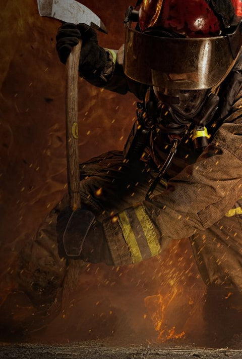 fireman in flames with an axe